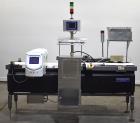 Used Mettler-Toledo Safeline Hi-Speed Model XE Combination Metal Detector and Checkweigher. Capable of speeds up to 500 packages per minute. Capable of weighing product up to 7kg. Approximate 7-3/4